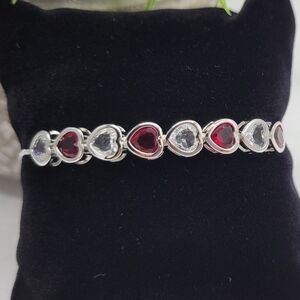 Ruby and cubic zirconia heart boho bracelet in silver plate. NWT